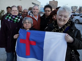 March For Jesus Celebration Event members Melinda Wilson, left, and Shirley Walsh hold their event flag which will not fly at City Hall following council's decision Monday, March 2, 2015.  March For Jesus Celebration Event is planned for August 22, 2015.  (NICK BRANCACCIO/The Windsor Star)