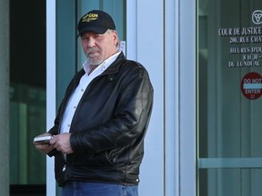 Mike Spencer walks out of Ontario Court of Justice, Tuesday, March 17, 2015. A WSIB security manager is seeking a peace bond against Spencer to stop him from posting allegedly derogatory and threatening comments online. (DAX MELMER/The Windsor Star)
