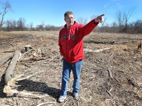 Kevin MacDonell is shown near his South Windsor home where a local developer has started cutting down trees. MacDonell said he was having a hard time getting any answers. "It's like nobody cares ... then it's going to be too late," he said.
DAN JANISSE/The Windsor Star