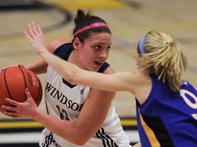 Lancers Jocelyn LaRocque looks for a lane against Lakehead University Thunderwolves Katie Ulakovic in Final Four Women's Basketball Championship at St. Denis Centre, March 6, 2015. (NICK BRANCACCIO/The Windsor Star)