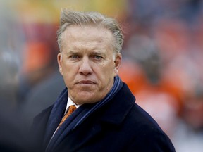 Denver Broncos Executive Vice President of Football Operations and General Manager, John Elway, watches his players prior to an NFL divisional playoff football game against the Indianapolis Colts, Sunday, Jan. 11, 2015, in Denver. (AP Photo/David Zalubowski)