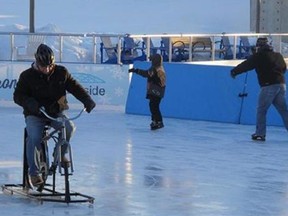 Dave Wolf of East Amherst, N.Y., tries out an ice bike at the Ice at Canalside in Buffalo, N.Y., Feb. 25, 2015. Wolf, who has Parkinson’s disease, rides a three-wheel bike for exercise in warmer weather and likes the cold-weather alternative debuted by Ice Bikes of Buffalo in December. (AP Photo/Carolyn Thompson)