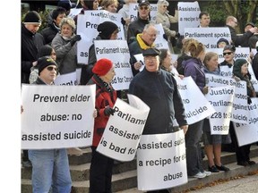 Demonstrators gather at the Courthouse to show their opposition to legally assisted suicide day November 14, 2011 in Vancouver, B.C. ( Ian Lindsay/Postmedia News files)
