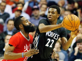 HOUSTON, TX - FEBRUARY 23:   James Harden #13 of the Houston Rockets defends against Andrew Wiggins #22 of the Minnesota Timberwolves during their game at the Toyota Center on February 23, 2015 in Houston, Texas. NOTE TO USER: User expressly acknowledges and agrees that, by downloading and/or using this photograph, user is consenting to the terms and conditions of the Getty Images License Agreement. (Photo by Scott Halleran/Getty Images)