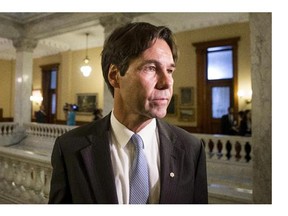 Dr. Eric Hoskins makes his way to a cabinet briefing after being sworn in as Health Minister at Queens Park in Toronto on Tuesday June 24, 2014.