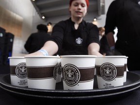 Baristas and other minimum wage workers will get a raise in Ontario, effective Oct. 1. (Associated Press files)