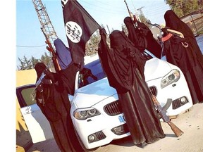 Last week, an image of a group of women in head-to-toe Islamic coverings sitting on a BMW and waving automatic rifles spread online.