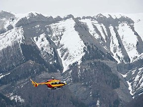 A helicopter of the French civil security services flies near Seyne, south-eastern France, on March 24, 2015, near the site where a Germanwings Airbus A320 crashed in the French Alps. A German airliner crashed near a ski resort in the French Alps on March 24, killing all 150 people on board, in the worst plane disaster in mainland France in four decades.