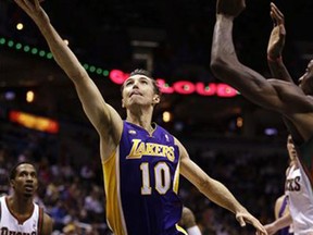 Los Angeles Lakers' Steve Nash (10) drives to the basket against the Milwaukee Bucks during the first half of an NBA basketball game, Thursday, March 28, 2013, in Milwaukee. (Canadian Press files)