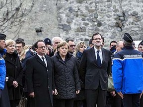 French President Francois Hollande (3rd L), German Chancellor Angela Merkel (C) and Spanish Prime Minister Mariano Rajoy (2nd R) arrive near the site of the German airliner that crashed in the French Alps, on March 25, 2015 in Seyne-les-Alpes, south-eastern France.  The three leaders, looking sombre and dressed in black, met rescue workers and police outside the crisis centre set up in the wake of yesterday's disaster, in which 150 people were killed in the Germanwings Airbus A320 that was travelling from Spain to Germany. AFP PHOTO / JEFF PACHOUDJEFF PACHOUD/AFP/Getty Images