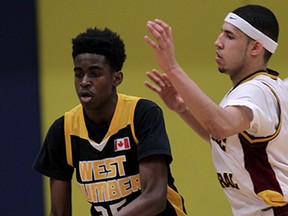 Catholic Central Comets Eriq Jenkins guards West Humber Vikings Keith Laryea in OFSSA basketball final at Kennedy Collegiate Institute Wednesday March 11, 2015.  (NICK BRANCACCIO/The Windsor Star)