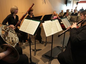 Windsor Symphony Orchestra members Iris Krizmanic, left, on French horn,  Julie Shier on bassoon, Margaret Gillie with clarinet, Liesel Deppe on flute and Faith Scholfield on oboe, perform in front of a full house at Windsor Star News Cafe on March 11, 2015.  (NICK BRANCACCIO/The Windsor Star)