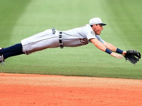 Detroit's Ian Kinsler dives for a ground ball during the fifth inning against the Houston Astros Thursday at Osceola County Stadium in Kissimmee, Fla. (Photo by Stacy Revere/Getty Images)