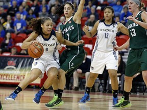 Windsor's Korissa Williams, left, drives to the basket against Saskatchewan at the CIS baskeball semifinals Saturday in Quebec City. (Mathieu Belanger/CIS)