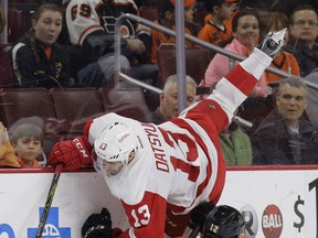 Detroit's Pavel Datsyuk, top, collides with Philadelphia's Michael Raffl during the first period Saturday in Philadelphia. (AP Photo/Matt Slocum)