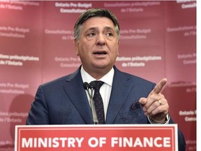 Ontario Finance Minister Charles Sousa speaks to the media prior to a pre-budget consultation session in Toronto on Friday, January 23, 2015. Ontario's finance minister says the province's deficit is $10.9 billion - lower than the previously projected $12.5 billion.THE CANADIAN PRESS/Frank Gunn Photograph by: Frank Gunn , Ottawa Citizen