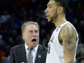 MSU coach Tom Izzo, left, talks to Denzel Valentine during their game against the Georgia Bulldogs during the second round of the 2015 NCAA Men's Basketball Tournament at Time Warner Cable Arena Friday in Charlotte. (Photo by Grant Halverson/Getty Images)