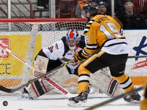 Sarnia's Patrick White, right, takes a shot on Windsor goalie Brendan Johnston during the Stings' 7-2 victory Friday in Sarnia. (Metcalfe Photography)