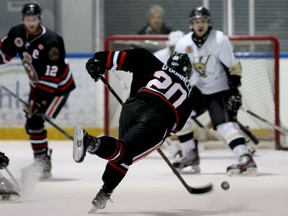 Sarnia's Jake O'Donnell, centre, takes a shot on the LaSalle net Saturday at the Vollmer Centre. (RICK DAWES/The Windsor Star)