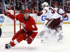 Detroit's Justin Abdelkader, left, celebrates his goal against the Arizona Coyotes during the second period at Joe Louis Arena Tuesday, March 24, 2015. (AP Photo/Paul Sancya)