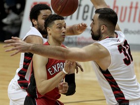 Windsor Express guard Ryan Anderson loses the ball against Brampton A's Thomas Granado. The two teams will play the next two games of the NBL Canada Central Division final at the 500-seat Athlete Institute in Orangeville because the A's couldn't get weekend dates at Brampton's Powerade Centre.