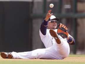 Detroit Tigers first baseman Miguel Cabrera throws to pitcher Alfredo Simon for the out on former Tiger Don Kelly of the Marlins during the first inning of a spring training exhibition game Wednesday in Lakeland, Fla. (AP Photo/Carlos Osorio)