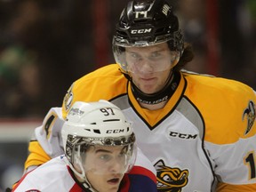 Windsor's Anthony Stefano, left, is checked by Sarnia's Pavel Zacha during the second period Sunday, March 1, 2015 at the WFCU Centre. (NICK BRANCACCIO/The Windsor Star)