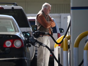 In this file photo, a customer pumps gasoline into his car at an Arco gas station on March 3, 2015 in Mill Valley, California. U.S. gas prices have surged an average of 39 cents in the past 35 days as a result of the price of crude oil prices increases, scheduled seasonal refinery maintenance beginning and a labor dispute at a Tesoro refinery. (Photo by Justin Sullivan/Getty Images)
