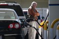 In this file photo, a customer pumps gasoline into his car at an Arco gas station on March 3, 2015 in Mill Valley, California. U.S. gas prices have surged an average of 39 cents in the past 35 days as a result of the price of crude oil prices increases, scheduled seasonal refinery maintenance beginning and a labor dispute at a Tesoro refinery. (Photo by Justin Sullivan/Getty Images)