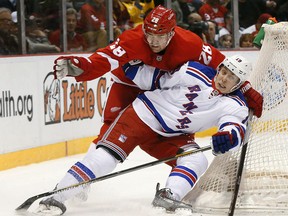 Detroit's Marek Zidlicky, left, checks New York's  Jesper Fast during the first period Wednesday at Joe Louis Arena. (AP Photo/Paul Sancya)