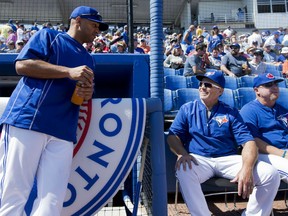 Former Blue Jay Vernon Wells, left, talks with Toronto manager John Gibbons, right, before the Jays faced the Pittsburgh Pirates in Dunedin, Fla. (THE CANADIAN PRESS/Nathan Denette)