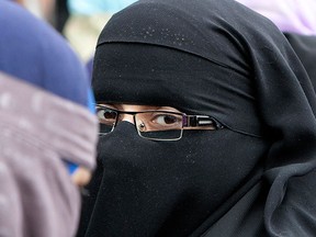 A woman in Montreal wears a burka. (Postmedia News files)