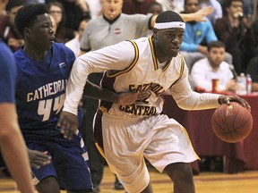 Cathedral High School's Mohammed Gaafer (L) pressures Catholic Central's Malique Calloo during OFSAA AAA basketball against Cathedral High School in Windsor, ON. on Wednesday, March 11, 2015. (DAN JANISSE/ The Windsor Star)