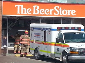 Paramedics tend to the driver of a 1997 Cadillac who drove through the front window of The Beer Store in Harrow on Sunday, March 16, 2015. (HANDOUT/The Windsor Star)
