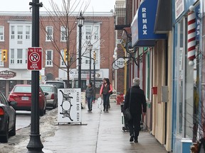 Residents walk down Main St. in  Brighton, Ont. on Saturday, March 14, 2015. Scott Quick who is accused of first degree murder in the death of his wife Nancy Quick moved to the eastern Ontario city about eight years ago. (DAN JANISSE/ The Windsor Star)