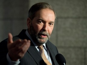 NDP Leader Tom Mulcair speaks with the media following caucus on Parliament Hill in Ottawa, Wednesday March 11, 2015. THE CANADIAN PRESS/Adrian Wyld
