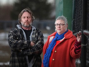 Marlene Westfall, 50, and Jeff Kerr, 58, left, are pictured at Remington Park, Friday, March 13, 2015, after a report from the local Health Unit identified a possible cancer cluster in the Remington Park neighbourhood.  Both Westfall and Kerr have had high incidences of cancer in their families. Westfall is currently in remission from breast cancer.  (DAX MELMER/The Windsor Star)