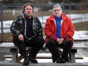 Marlene Westfall, 50, and Jeff Kerr, 58, left, are pictured at Remington Park, Friday, March 13, 2015, after a report from the local Health Unit identified a possible cancer cluster in the Remington Park neighbourhood.  Both Westfall and Kerr have had high incidences of cancer in their families. Westfall is currently in remission from breast cancer.  (DAX MELMER/The Windsor Star)