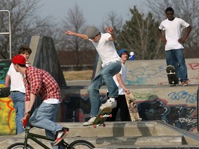 In this file photo, warm weather and March break from school makes Forest Glade's skate park a busy spot.  A group of teens enjoy the sunny afternoon on their skateboards and bicycles.