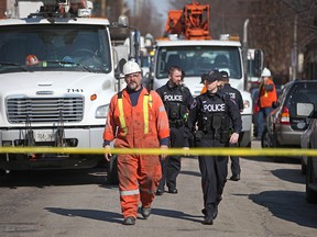 WINDSOR, ONT., (09/03/15) -- Windsor police work at the scene of an industrial accident on Shepherd Ave. between Bruce Ave. and York St. involving a worker from Enwin Utilities, Monday, March 9, 2015.  (DAX MELMER/The Windsor Star)