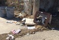 Garbage lies strewn about an alley in the Walkerville area. Representatives of Windsor police, firefighters, and city council are holding a neighbourhood watch meeting on Mar. 25 to address 'fires of opportunity' and the crime of arson's relationship with trash. (Tyler Brownbridge / The Windsor Star)