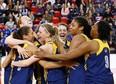 Korissa Williams, from left, Emily Prevost, Caitlyn
Longmuir, Andrea Kiss,
Cheyanne Roger and Chidera Ifearulundu celebrate after the Lancers won their fifth straight CIS women's basketball championship Sunday, March 15, 2015 l in Quebec City.  (Yan Doublet/Special to the Star)