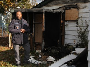 Const. Mike Akpata of Windsor police at the scene of an arson in the 1600 block of Hall Avenue in November 2014. (Jason Kryk / The Windsor Star)