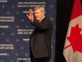 Prime Minister Stephen Harper greets the crowd prior to participating in a moderated question and answer session at the Saskatchewan Association of Rural Municipalities annual convention in Saskatoon on Thursday, March 12, 2015. THE CANADIAN PRESS/Liam Richards