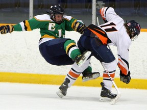 L'Essor's Stephen Holland, right, lays a hit on Lajeunesse's Anthony Difranco at Tecumseh Arena Thursday. (TYLER BROWNBRIDGE/The Windsor Star)