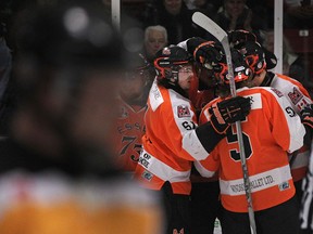 The Essex 73's celebrate after their second goal of the first period in the opening game of the Schmalz Cup quarter final series between the Essex 73's and the visiting Exeter Hawks at Essex Arena, Tuesday, March 17, 2015.  (DAX MELMER/The Windsor Star)