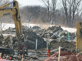 Property on Matchette Road in Windsor, Ont. near the Ambassador Golf course is being prepared for new housing. Workers are shown on Monday, March 2, 2015. (DAN JANISSE/ The Windsor Star)