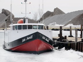 The fishing boat Edith Marie !!, shown Thursday, March 19, 2015, is stuck in the foot thick ice at the Kingsville Harbour. (DAN JANISSE/ The Windsor Star)