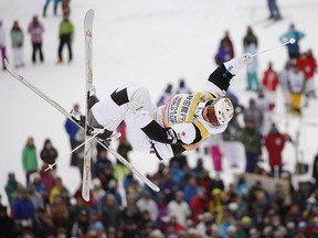 Mikael Kingsbury of Canada competes on his way to winning his sixth straight World Cup moguls event on Saturday Feb. 28, 2015 in Tazawako, Akita prefecture, northern Japan. (AP Photo/Kyodo News)