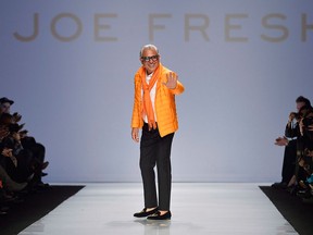 Joe Fresh creative director Joe Mimran greets the crowd after his collection on the runway during Toronto Fashion Week in Toronto on March. 19, 2014. The namesake behind affordable apparel brand Joe Fresh has left the company. In an email to The Canadian Press, Loblaw spokesman Kevin Groh confirmed the departure of Joe Fresh creative director Joe Mimran, effective Monday. THE CANADIAN PRESS/Nathan Denette